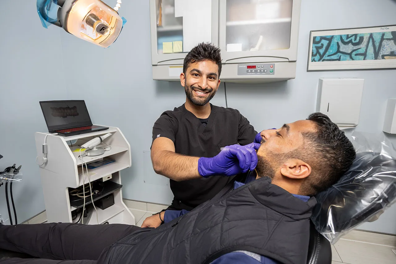 Dr. Nilay examining a patient at Big City Dental in Chicago