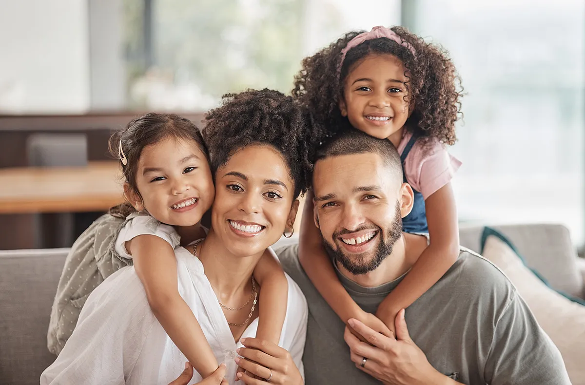Family smiling together at home