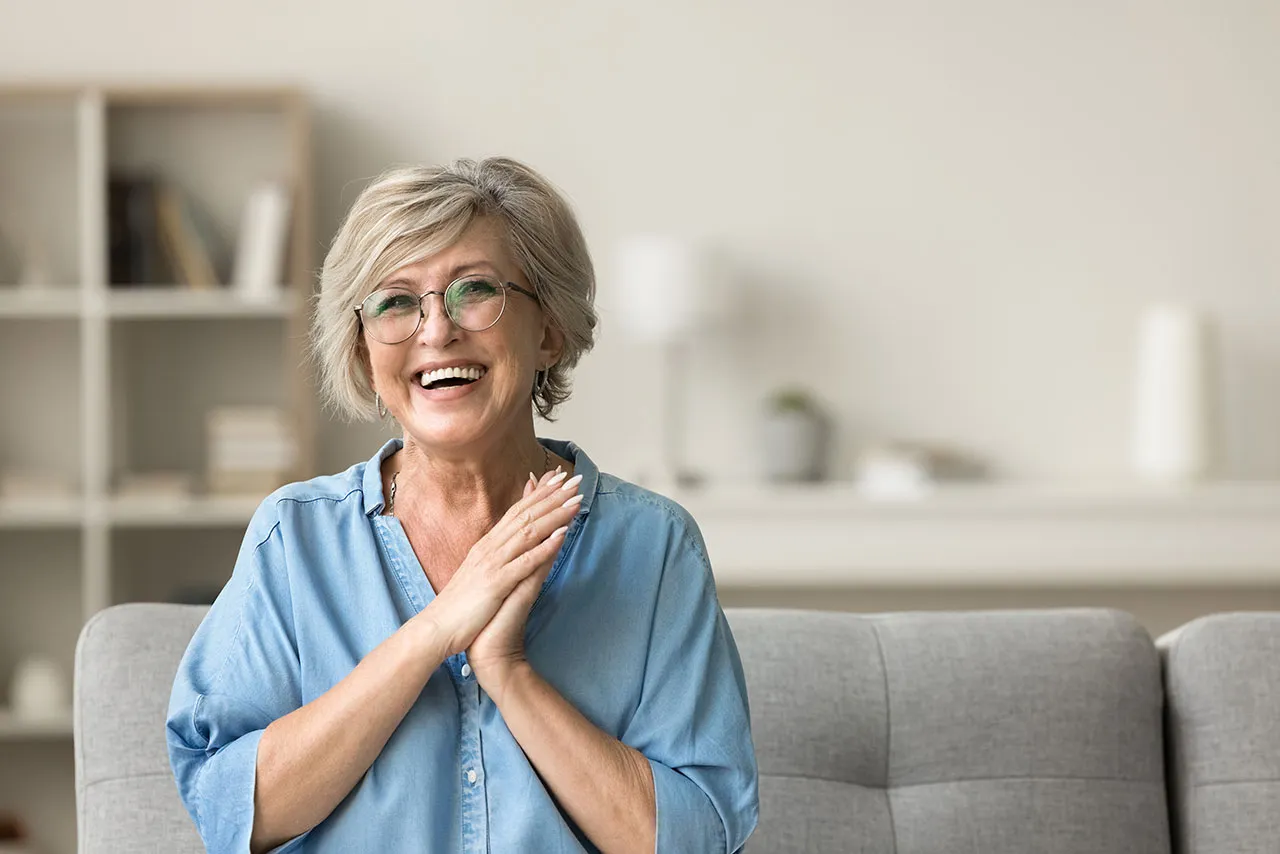 Older woman smiling at home