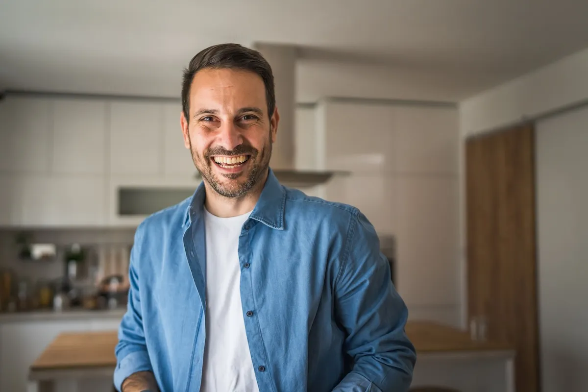 Smiling man at home